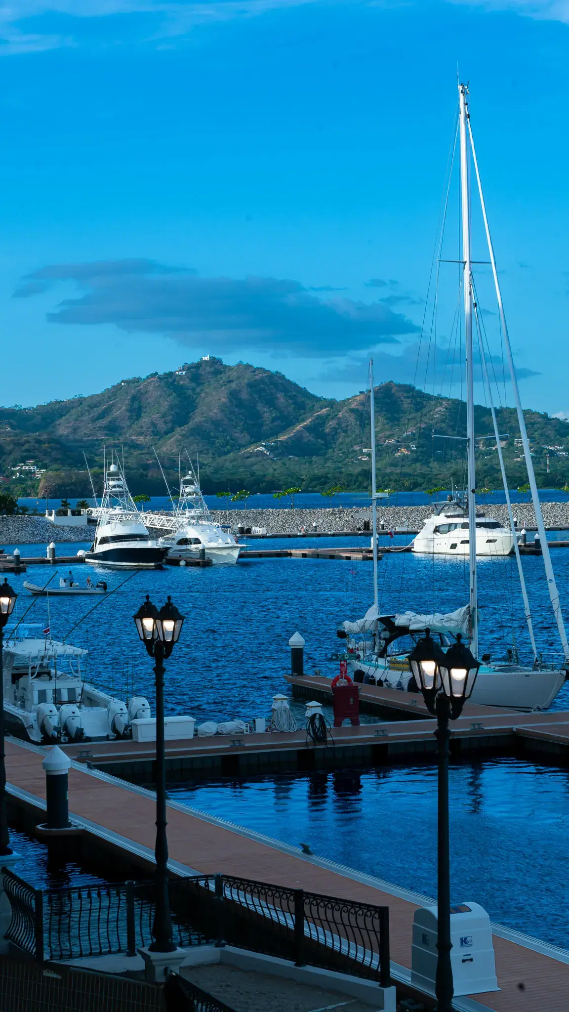 Flamingo marina with yachts and green hills in Guanacaste